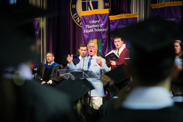Record number of graduates celebrated; updated alma mater led by Pat Boone