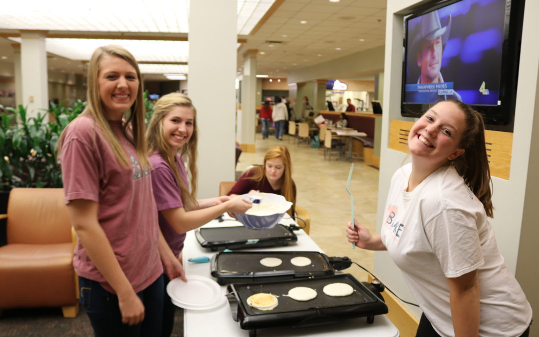Delta Omega hosts pancake, waffle bar to raise awareness for Rett Syndrome